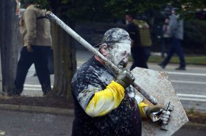 proud boy with shield and bat gets painted